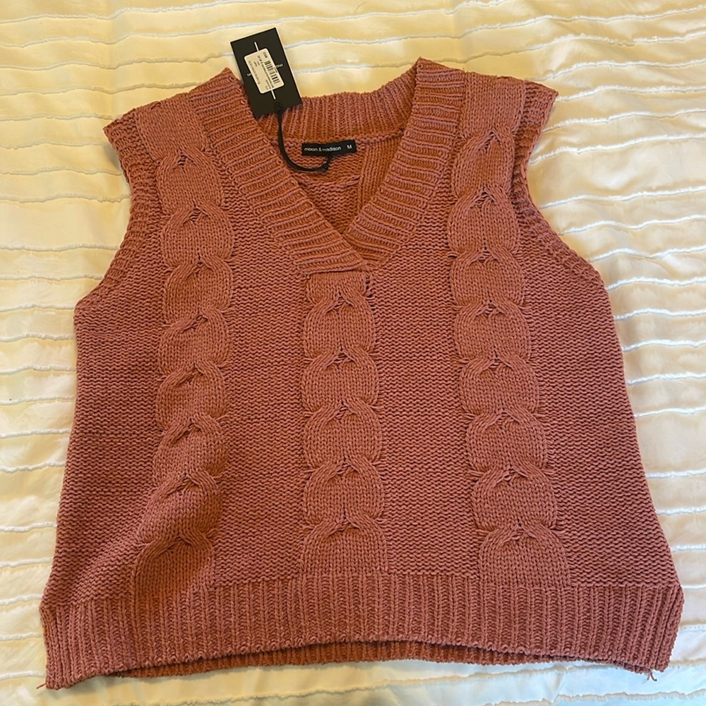 Brand new never worn knitted pink sleeveless sweater. Great condition!
